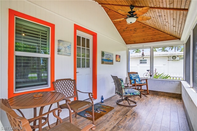 sunroom featuring wooden ceiling, ceiling fan, and vaulted ceiling