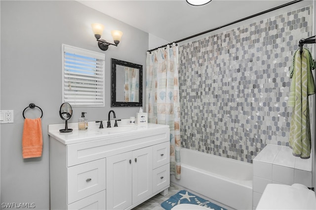 full bathroom featuring shower / tub combo with curtain, vanity, tile patterned flooring, and toilet