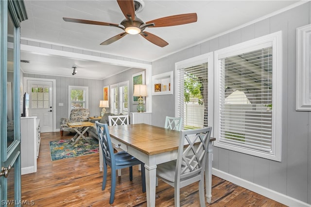 dining room with ornamental molding, ceiling fan, and hardwood / wood-style floors