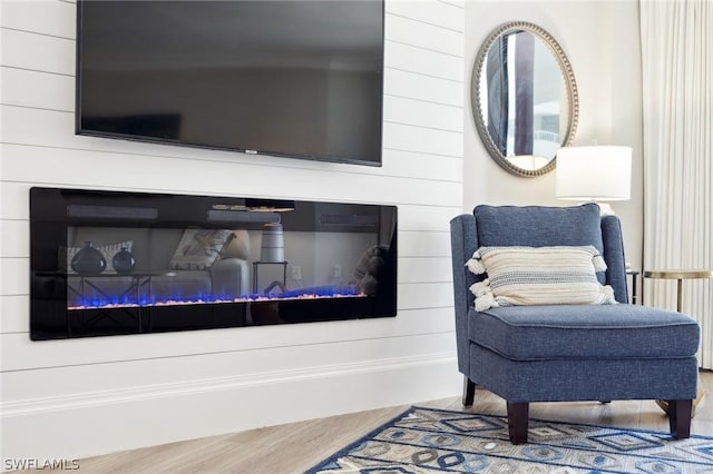 living area with wood-type flooring