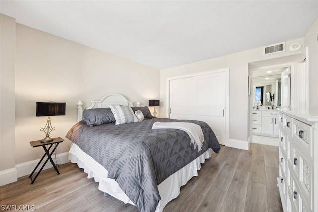 bedroom with a closet and light wood-type flooring