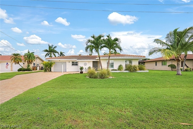 view of front of house with a front lawn and a garage