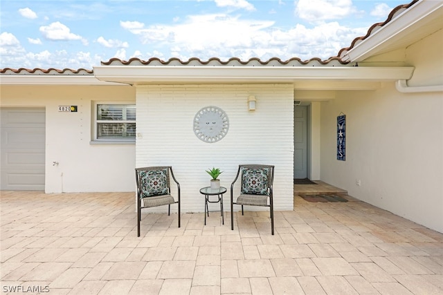 view of patio with a garage