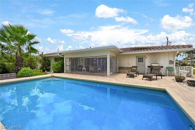 view of swimming pool featuring a patio area