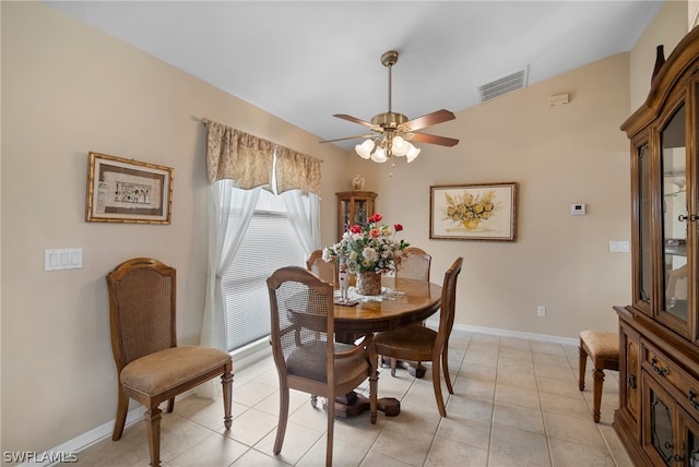 dining area featuring ceiling fan and light tile patterned floors