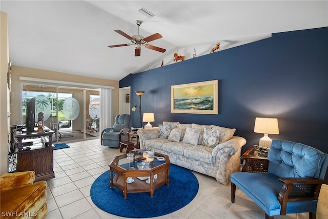 living room with ceiling fan, light tile patterned flooring, and lofted ceiling