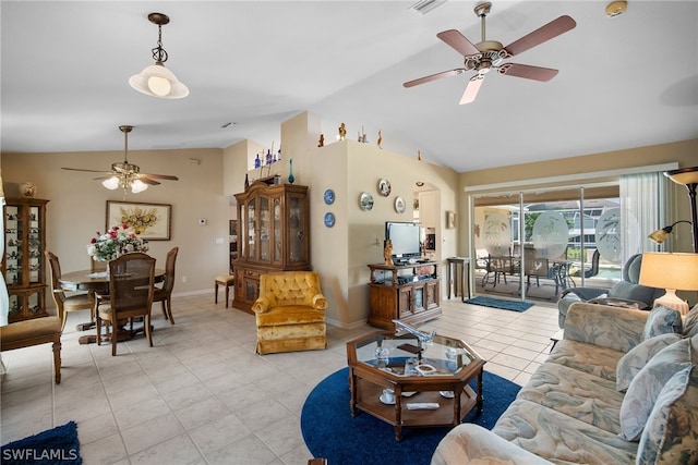 tiled living room with ceiling fan and vaulted ceiling