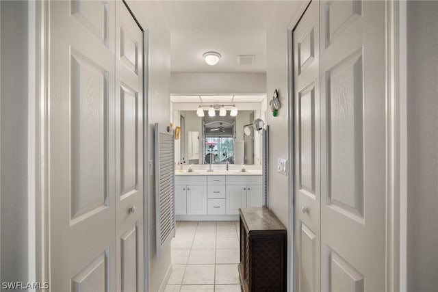 bathroom featuring tile patterned floors and vanity