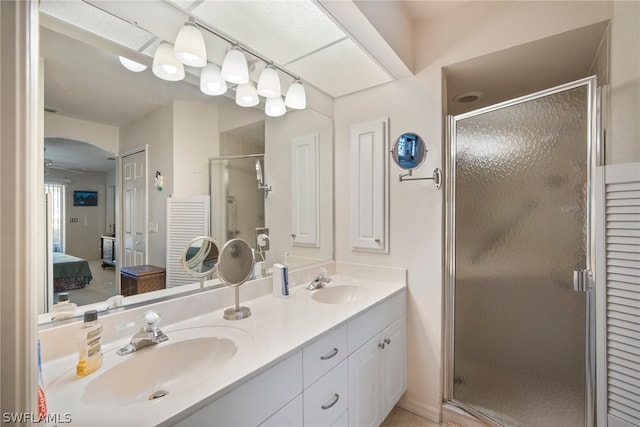 bathroom with vanity and walk in shower