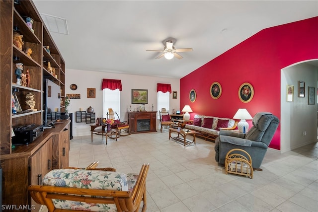 tiled living room with ceiling fan