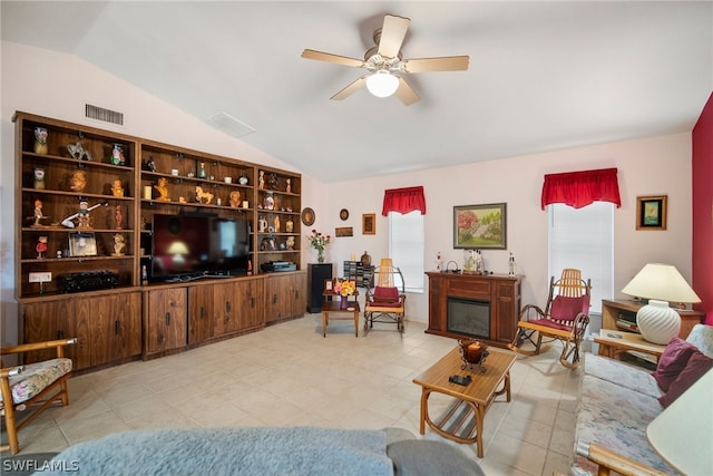 tiled living room featuring vaulted ceiling and ceiling fan