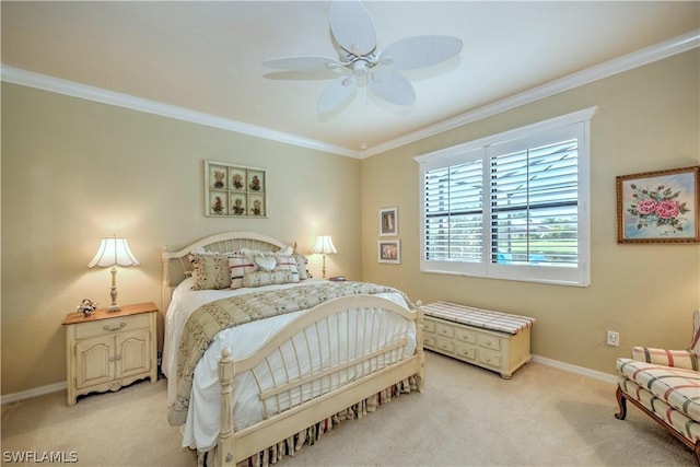 carpeted bedroom with ceiling fan and ornamental molding