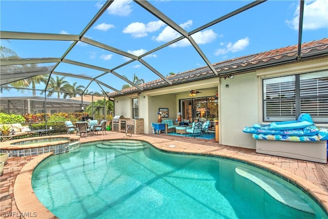 view of swimming pool with an in ground hot tub, a patio, and a lanai