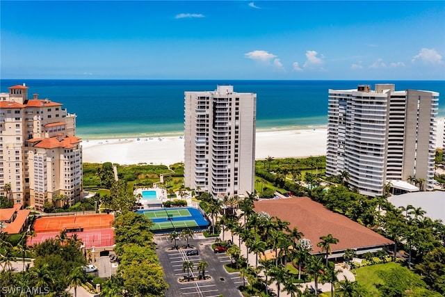 aerial view featuring a water view and a beach view