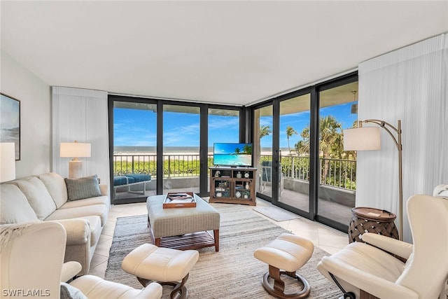 tiled living room with expansive windows and plenty of natural light