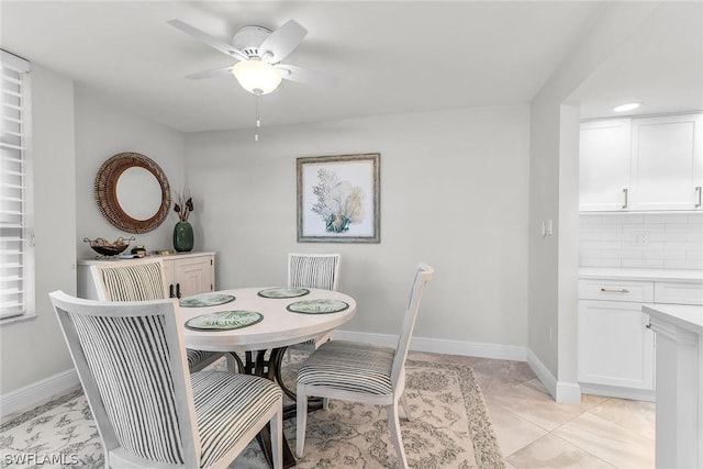 dining room featuring light tile patterned flooring and ceiling fan