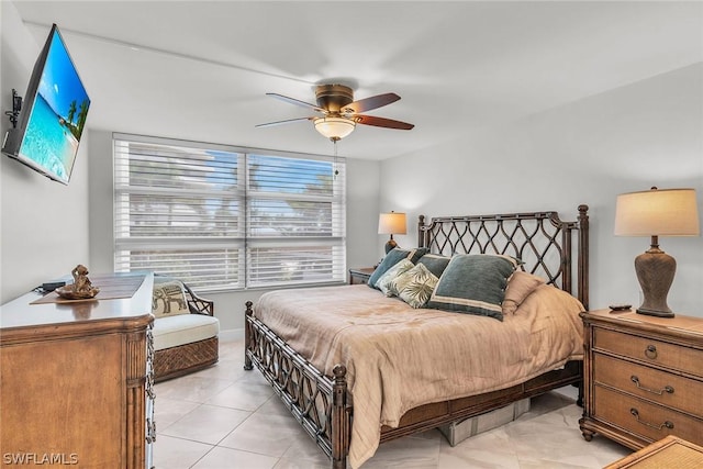 bedroom featuring light tile patterned floors and ceiling fan