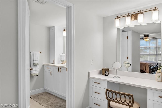 bathroom featuring ceiling fan and vanity