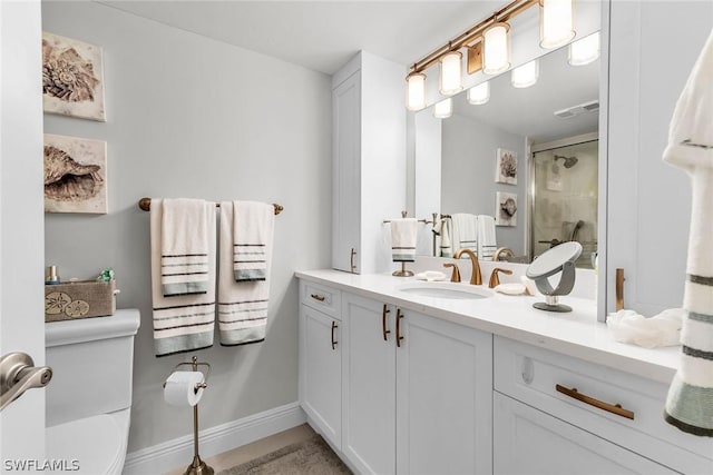 bathroom with vanity and a shower with shower door