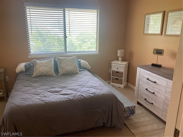 bedroom with light colored carpet