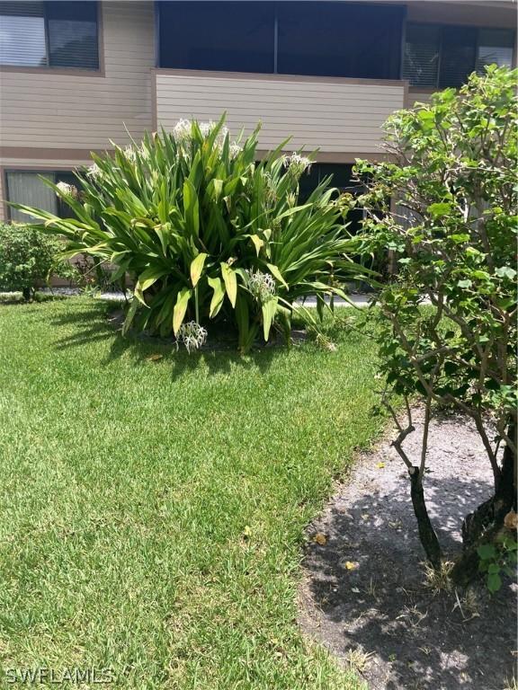 64 4th St Unit B201, Bonita Springs, FL 34134 - view of green lawn