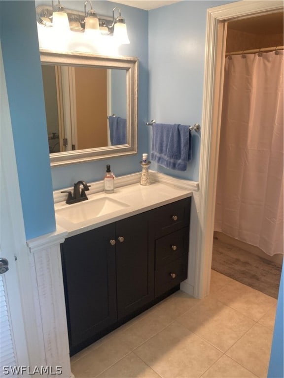 bathroom with tile patterned floors and vanity