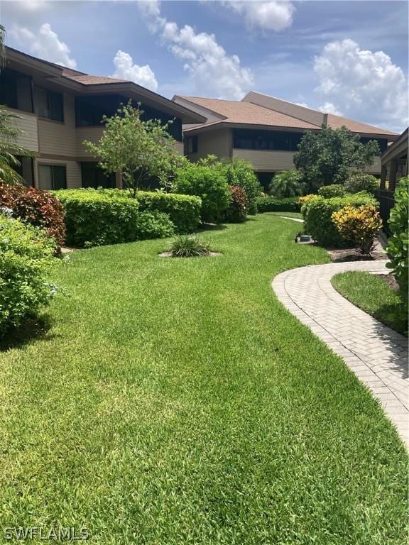 64 4th St Unit B201, Bonita Springs, FL 34134 - view of grassy yard