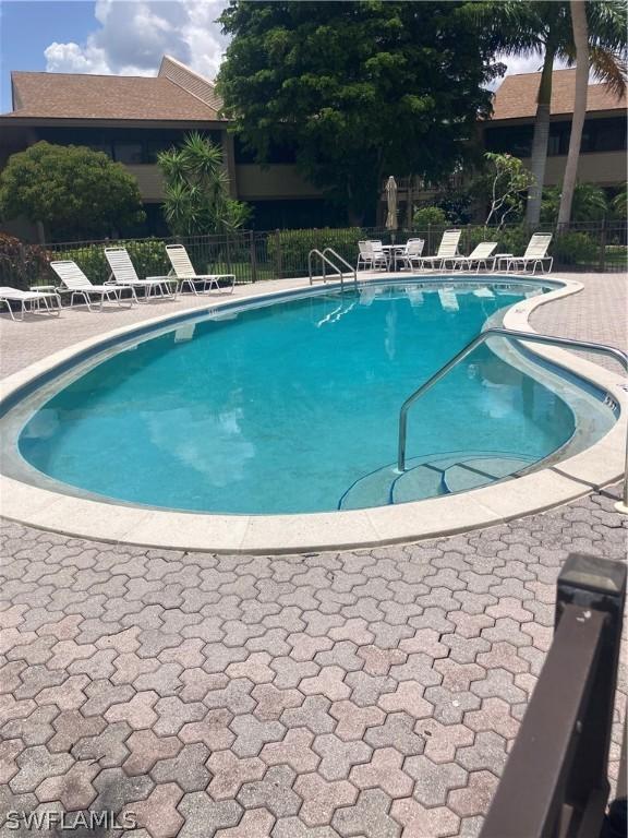 64 4th St Unit B201, Bonita Springs, FL 34134 - community pool featuring a patio area