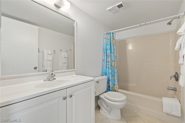 full bathroom with toilet, tile patterned flooring, shower / bath combo with shower curtain, and vanity