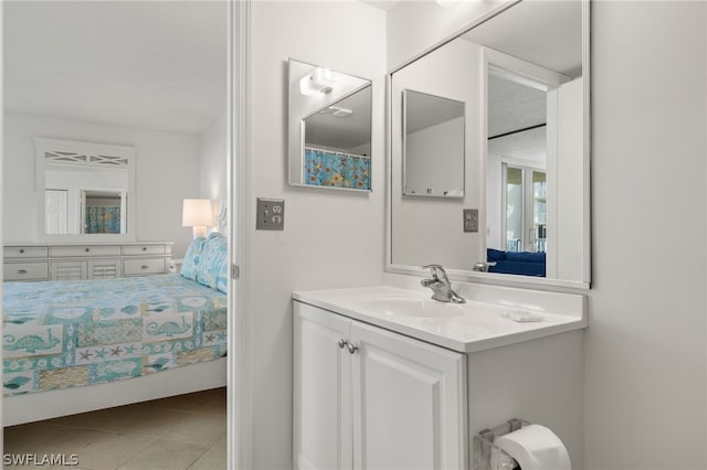 bathroom featuring tile patterned floors and vanity