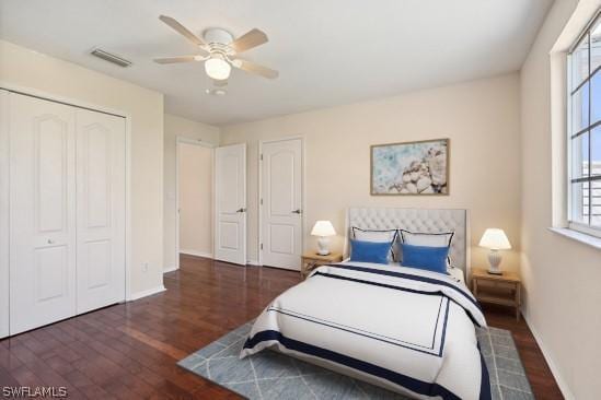 bedroom featuring ceiling fan, dark hardwood / wood-style flooring, and a closet