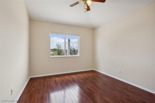 empty room featuring ceiling fan and dark hardwood / wood-style flooring