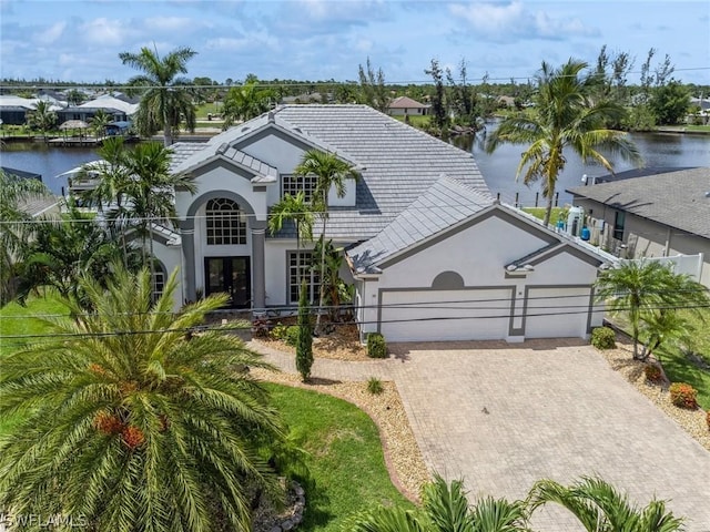 view of front of house featuring a water view and a garage