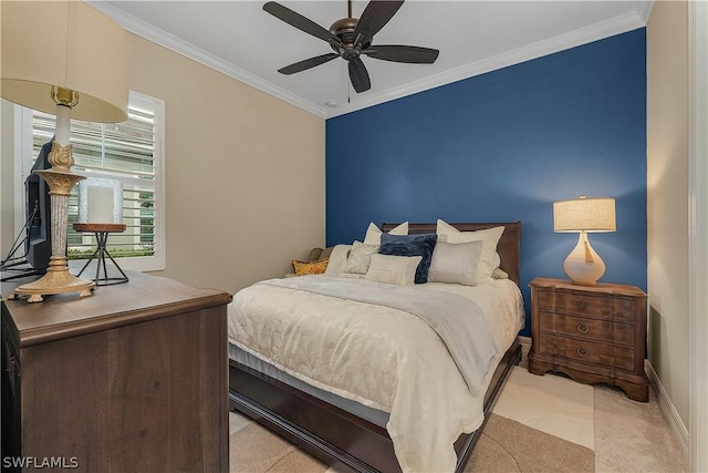 bedroom featuring ceiling fan, light colored carpet, and ornamental molding