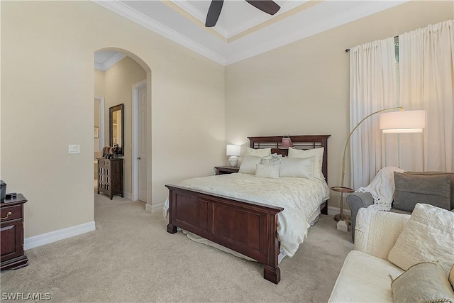 carpeted bedroom featuring ceiling fan and crown molding