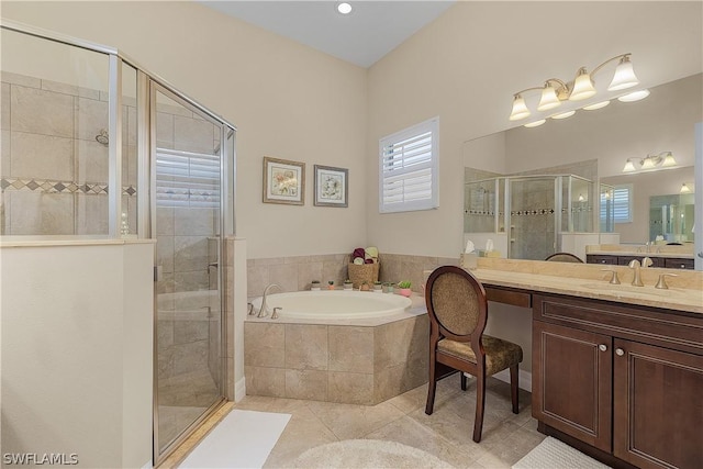 bathroom with tile patterned flooring, vanity, and independent shower and bath