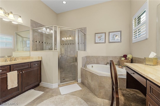 bathroom featuring tile patterned flooring, vanity, a healthy amount of sunlight, and shower with separate bathtub