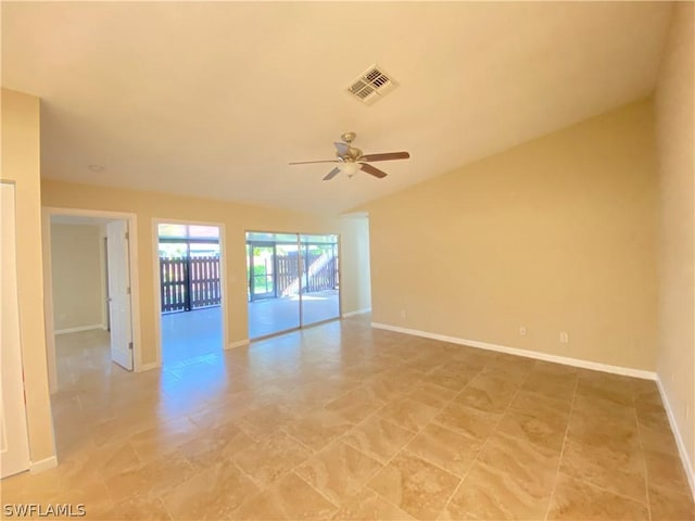 unfurnished room featuring lofted ceiling and ceiling fan