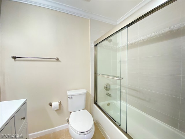 full bathroom featuring bath / shower combo with glass door, toilet, vanity, crown molding, and tile patterned floors