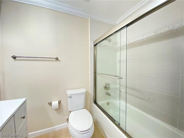 full bathroom with crown molding, bath / shower combo with glass door, vanity, tile patterned floors, and toilet