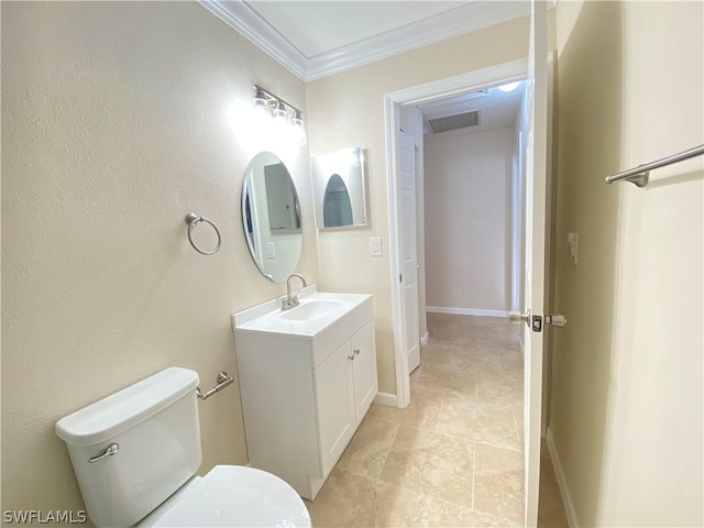 bathroom with toilet, crown molding, and vanity