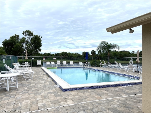 view of swimming pool featuring a patio area