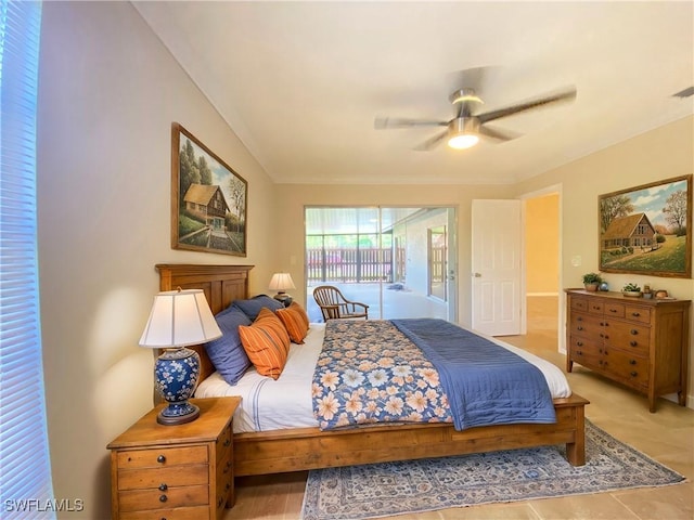 bedroom with access to outside and ceiling fan