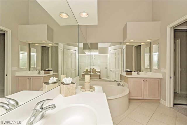 bathroom featuring tile patterned flooring, vanity, independent shower and bath, and a high ceiling