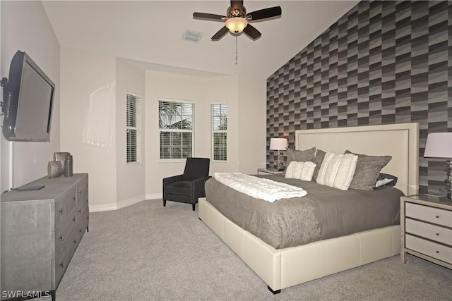 carpeted bedroom featuring vaulted ceiling and ceiling fan