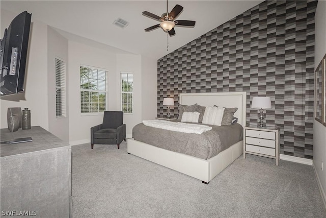 carpeted bedroom featuring ceiling fan and lofted ceiling