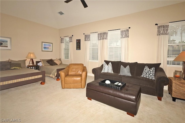 living room with carpet flooring and ceiling fan