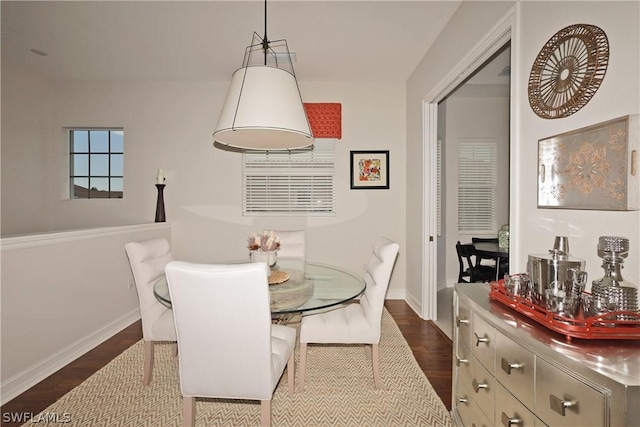 dining area featuring dark hardwood / wood-style flooring