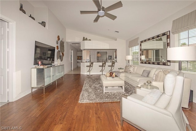 living room featuring dark hardwood / wood-style flooring, ceiling fan, and lofted ceiling