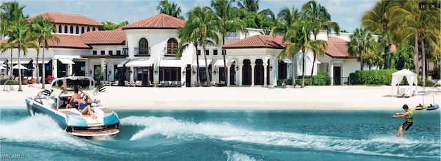 view of swimming pool with a water view